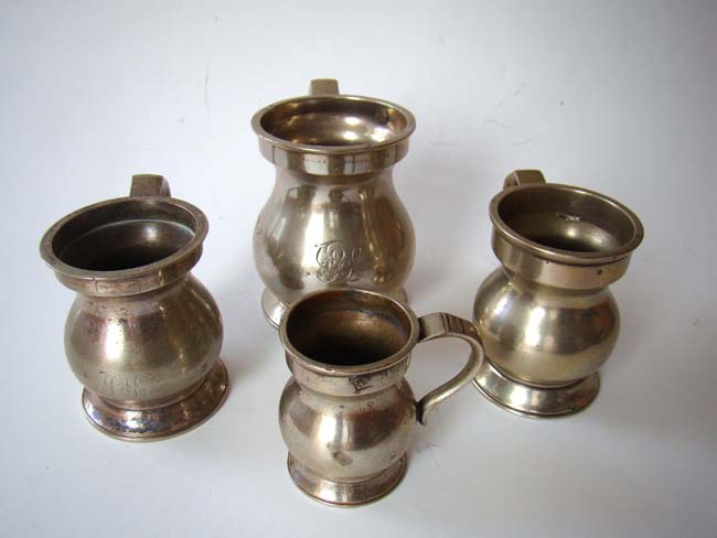 A collection of four antique English pewter tavern measures circa 1840-1880